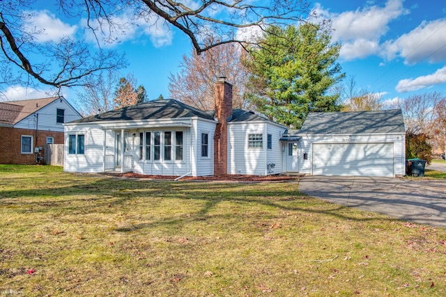 ranch-style home featuring a garage and a front yard