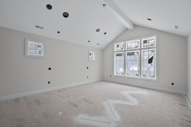 empty room with vaulted ceiling with beams