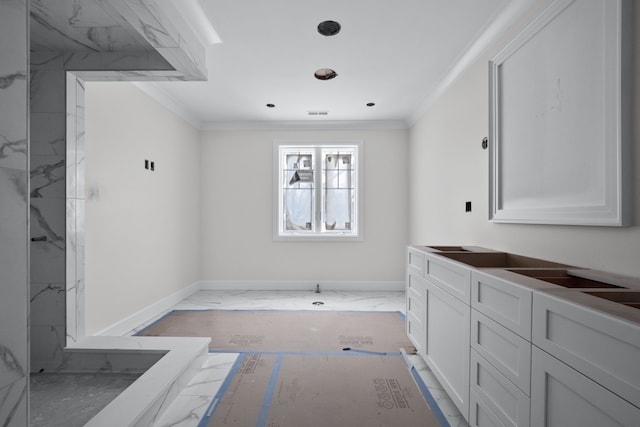 bathroom with a shower, vanity, and ornamental molding