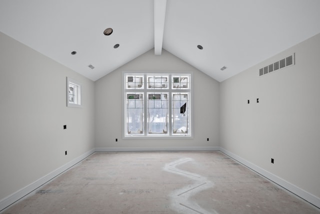 empty room featuring vaulted ceiling with beams