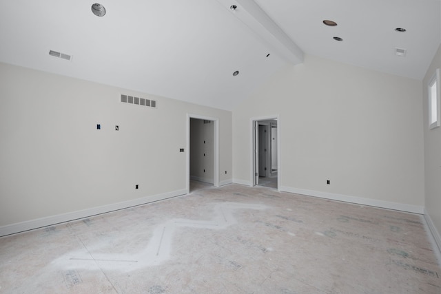 unfurnished room featuring lofted ceiling with beams