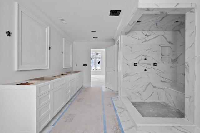 bathroom featuring a shower, crown molding, and vanity