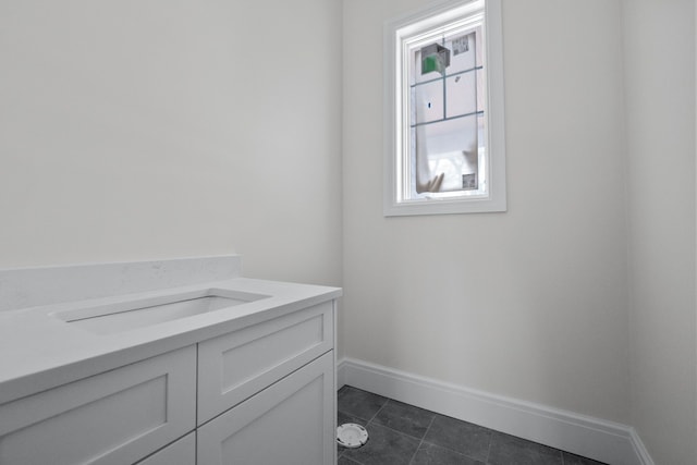 bathroom featuring tile patterned floors and vanity