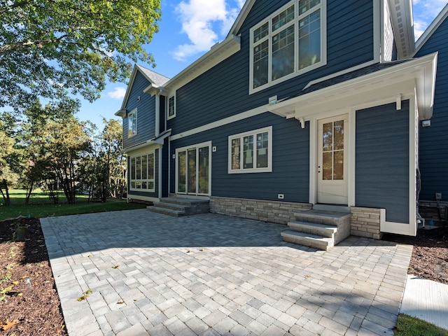 rear view of property with a patio area