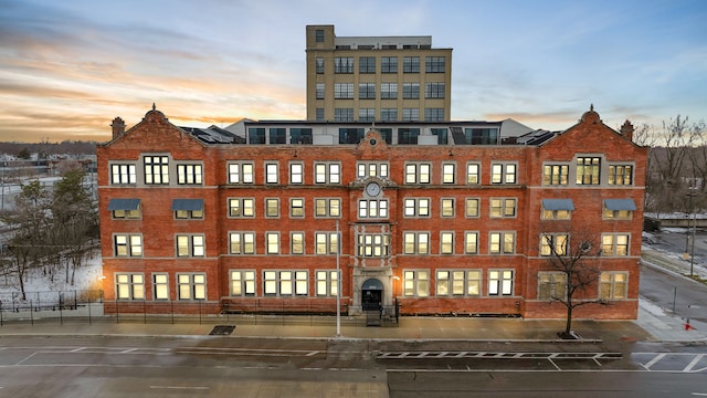 view of outdoor building at dusk