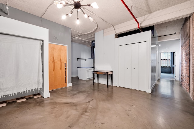 basement featuring a chandelier