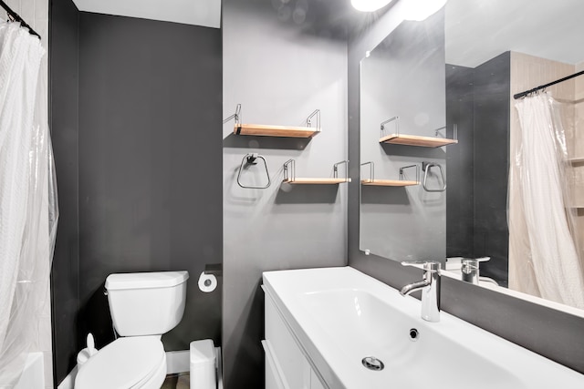 bathroom featuring toilet and vanity