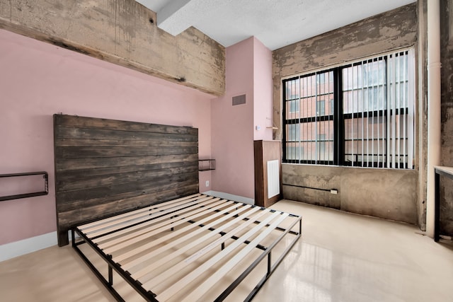 bedroom with beam ceiling