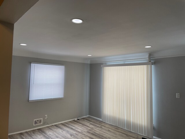 spare room featuring light wood-type flooring