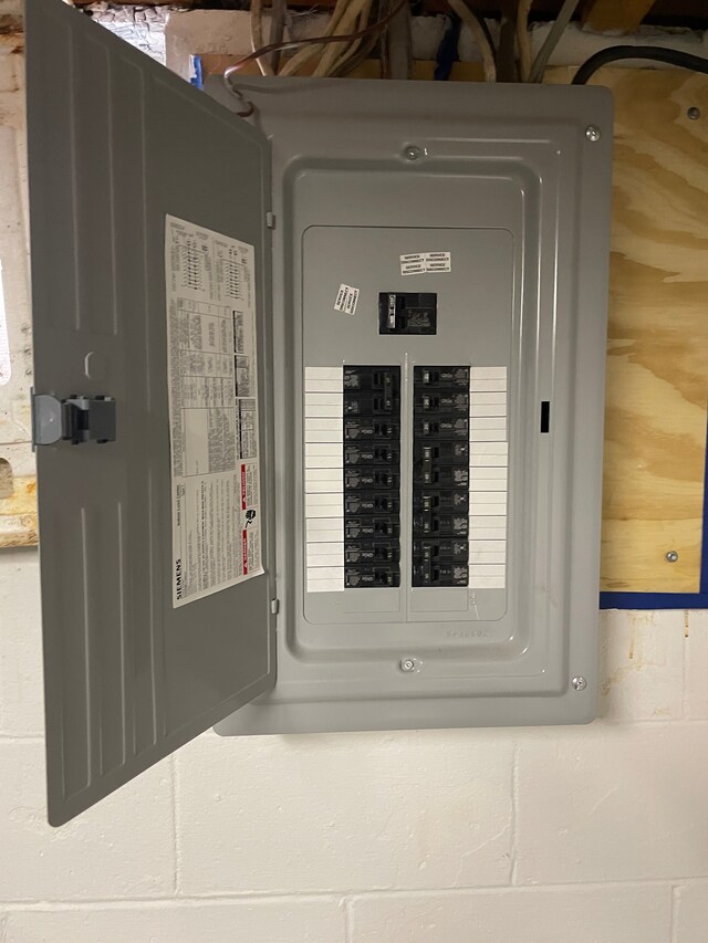 utility room featuring electric panel