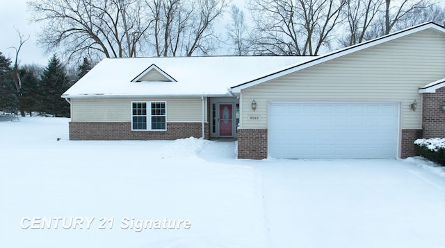 single story home featuring a garage