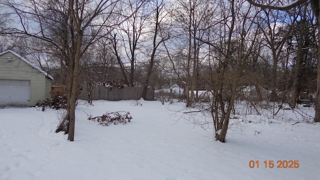 view of yard layered in snow