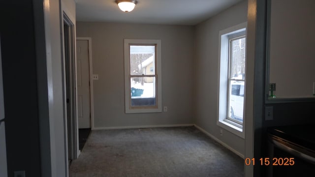 interior space featuring dark colored carpet