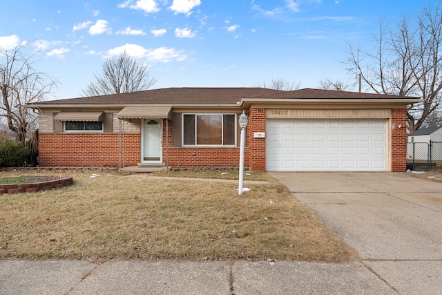 ranch-style house with a garage and a front yard