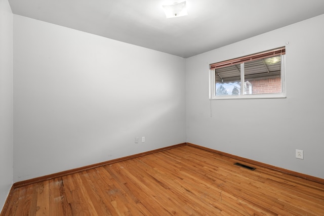 unfurnished room with light hardwood / wood-style flooring