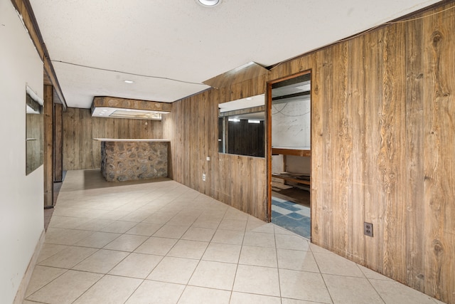 tiled empty room with wooden walls