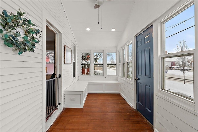 mudroom featuring ceiling fan, dark wood-type flooring, and lofted ceiling