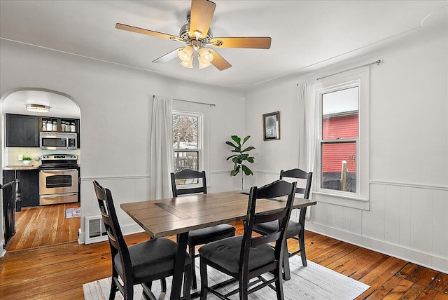 dining space featuring ceiling fan and hardwood / wood-style floors