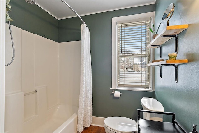 bathroom featuring toilet, wood-type flooring, and shower / bath combo