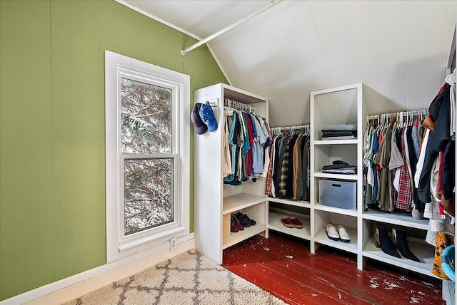 walk in closet with lofted ceiling