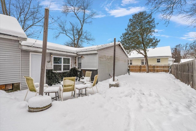 view of snow covered house