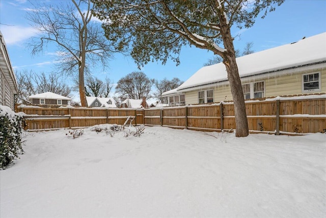 view of yard layered in snow