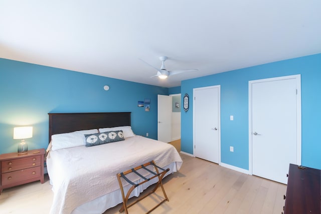 bedroom featuring ceiling fan and light hardwood / wood-style flooring