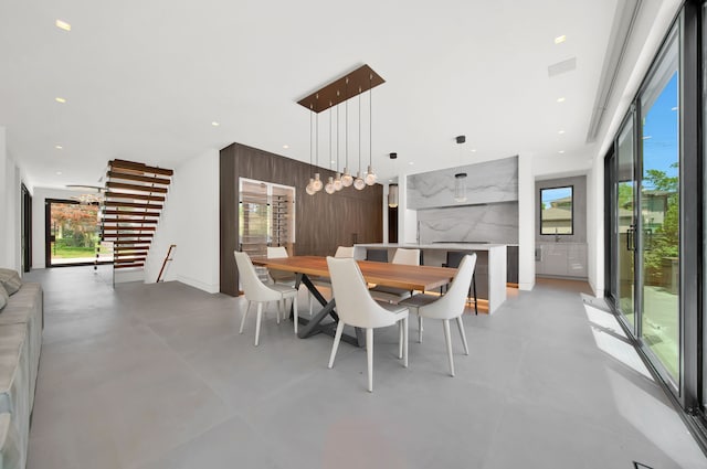 dining room with wooden walls