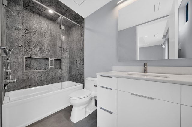 full bathroom with toilet, vanity, tiled shower / bath, and tile patterned flooring