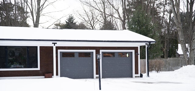 view of snow covered garage