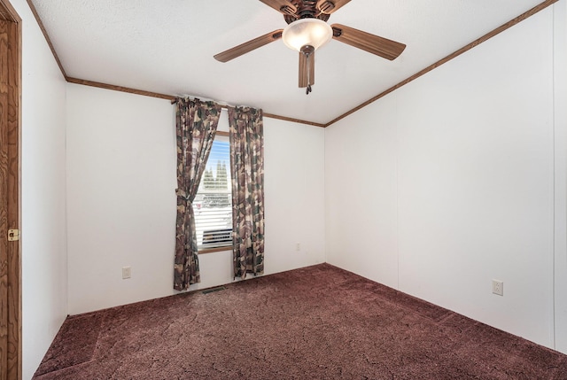 carpeted spare room featuring ceiling fan, a textured ceiling, and ornamental molding