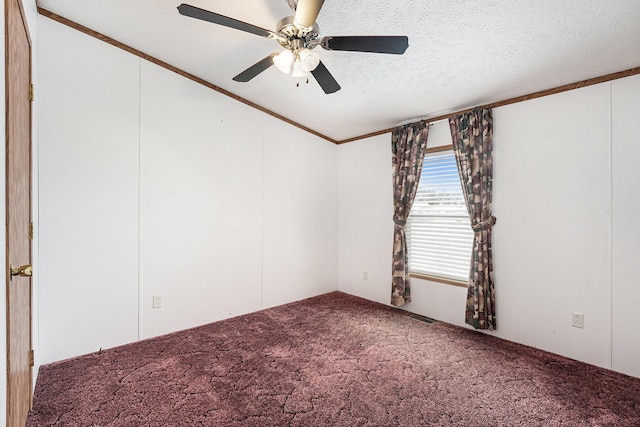 empty room featuring ceiling fan, crown molding, a textured ceiling, and carpet flooring