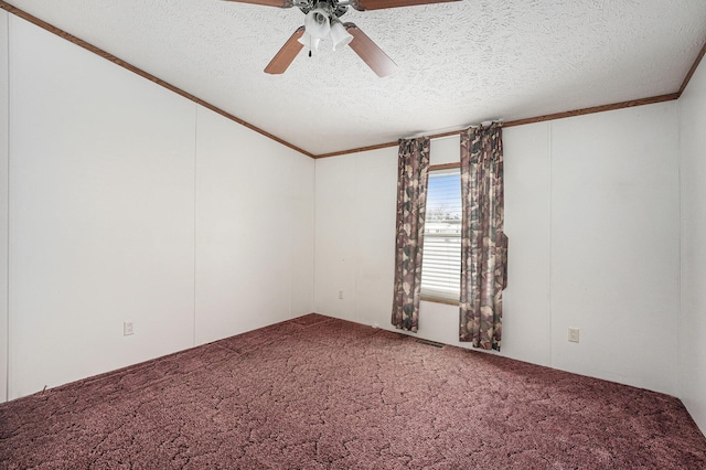 carpeted empty room featuring ceiling fan, crown molding, and a textured ceiling