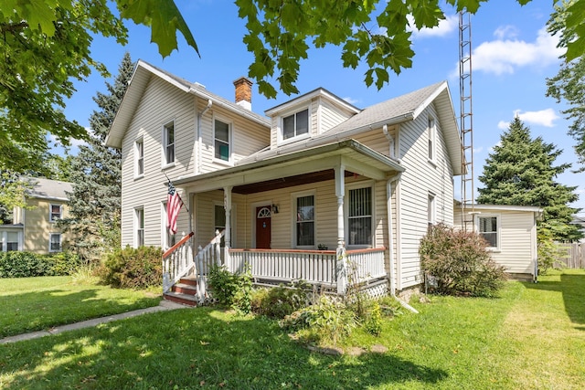 view of front of home with a front lawn and a porch