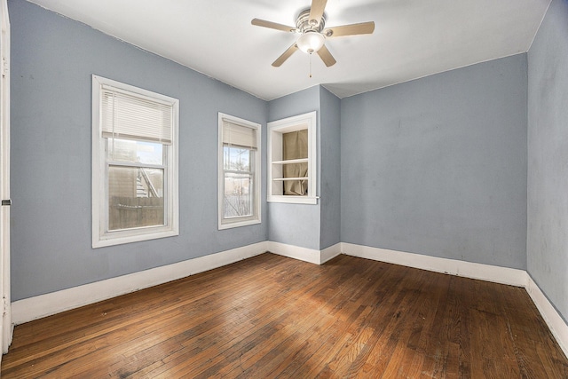 spare room featuring ceiling fan and dark hardwood / wood-style flooring