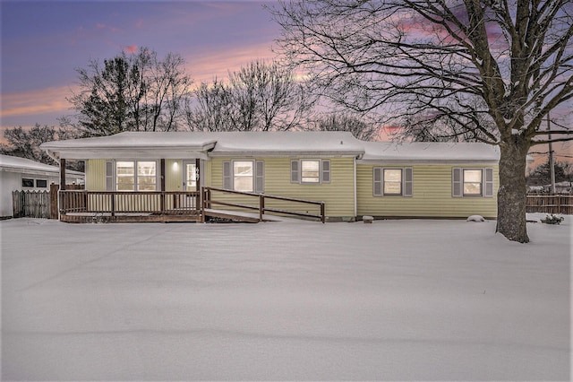 view of back house at dusk