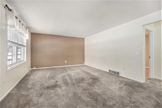 empty room featuring carpet flooring