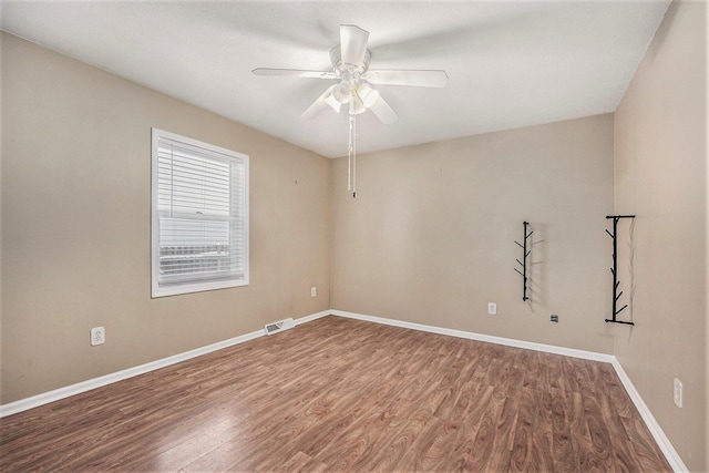 spare room featuring ceiling fan and hardwood / wood-style floors