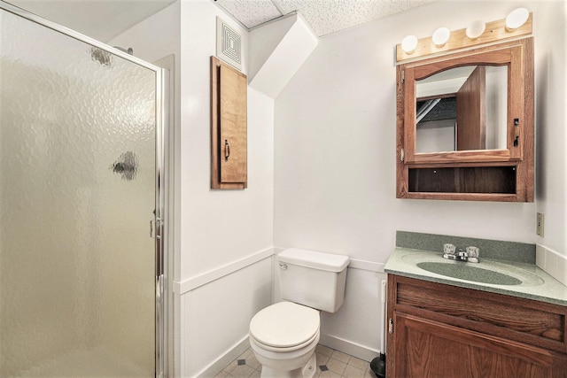 bathroom featuring a textured ceiling, an enclosed shower, tile patterned floors, vanity, and toilet