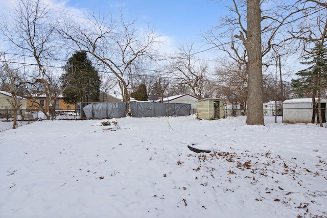 view of yard layered in snow