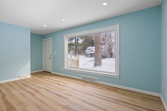 unfurnished room with light hardwood / wood-style flooring