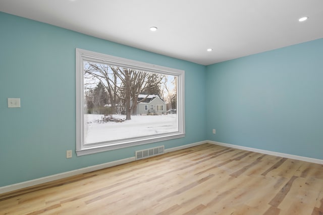 empty room featuring light hardwood / wood-style floors