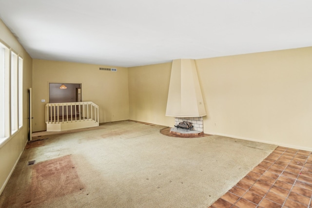 spare room with carpet flooring and plenty of natural light