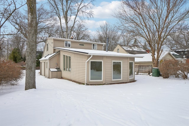 view of snow covered house