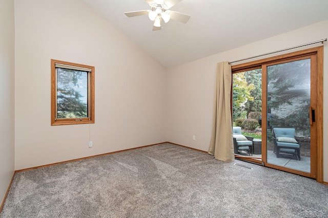 spare room with carpet, ceiling fan, and high vaulted ceiling