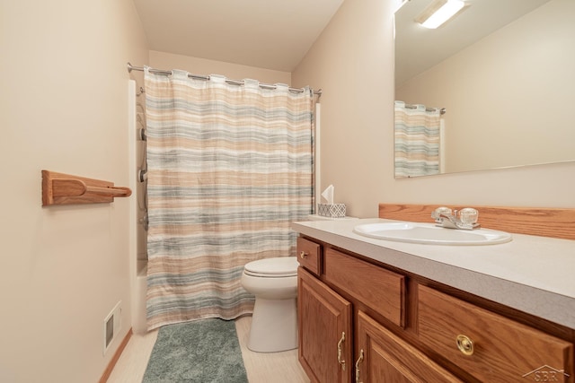 full bathroom with toilet, vanity, and shower / tub combo with curtain