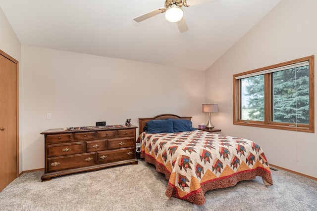 bedroom featuring ceiling fan, light carpet, and vaulted ceiling