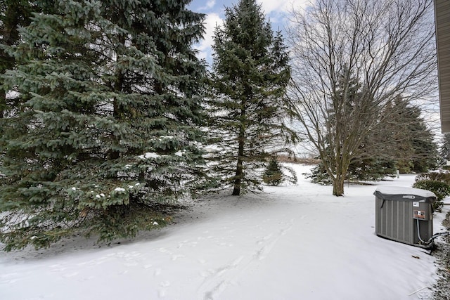 snowy yard with central air condition unit