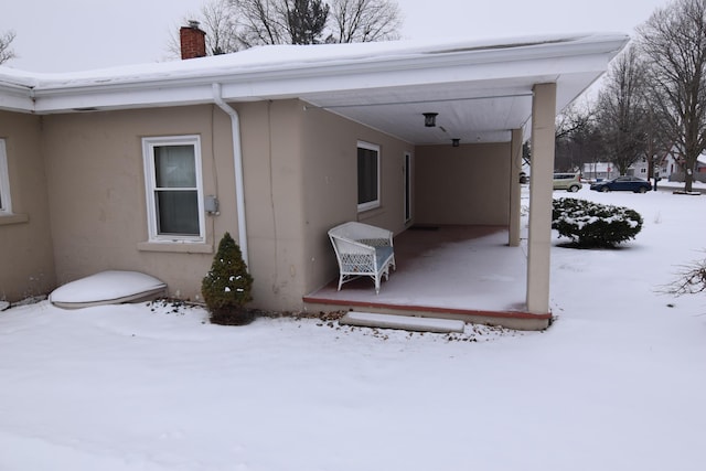 view of snow covered property