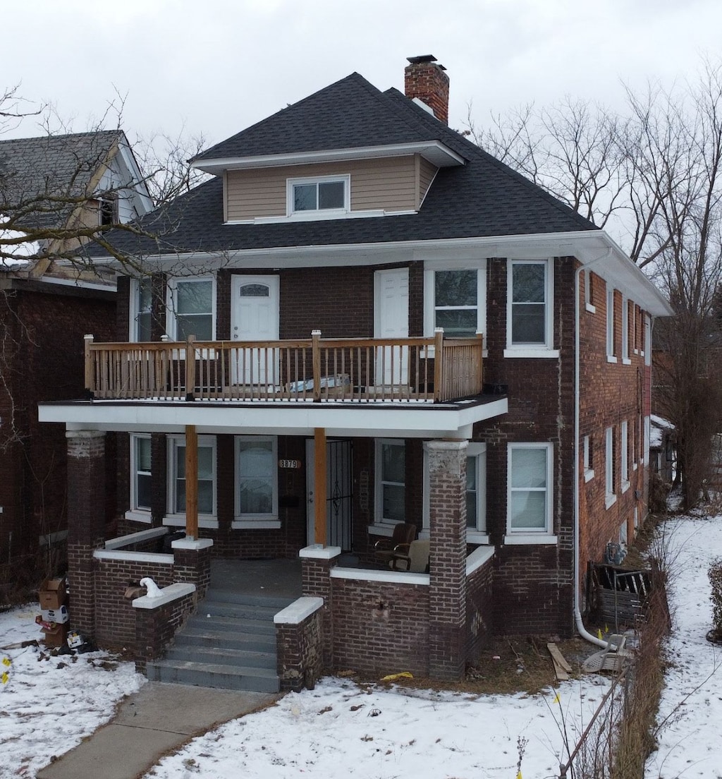 view of front of home with a balcony and a porch